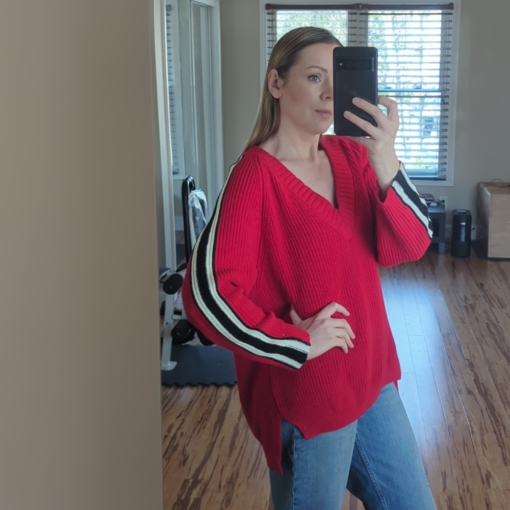 Bright red v-neck cotton/acrylic sweater. Not new but in great condition.